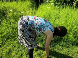 Bending down at the hips, but with some back curvature