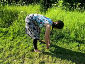 Bending down using the hips to prevent back pain